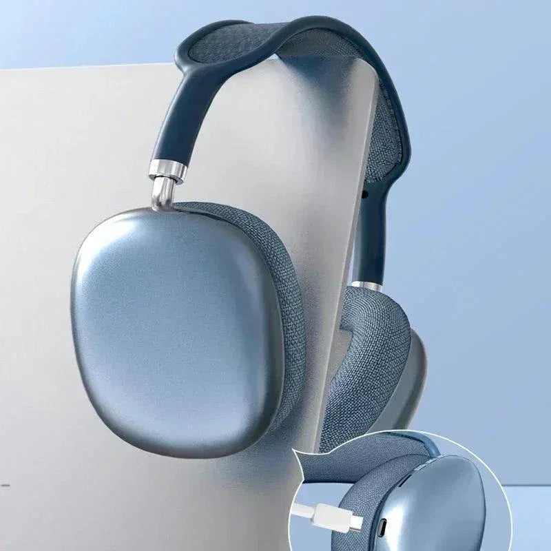 Blue wireless over-ear headphones with padded fabric ear cups and USB-C charging port, displayed on light background