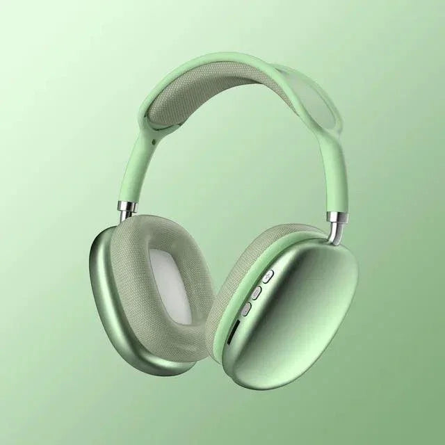 Light green wireless over-ear headphones with cushioned ear pads and headband, sleek modern design